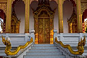 Luang Prabang, Laos - Wat Nong Sikhunmuang, the staircases on either side of the temple are adorned with naga balustrades.  